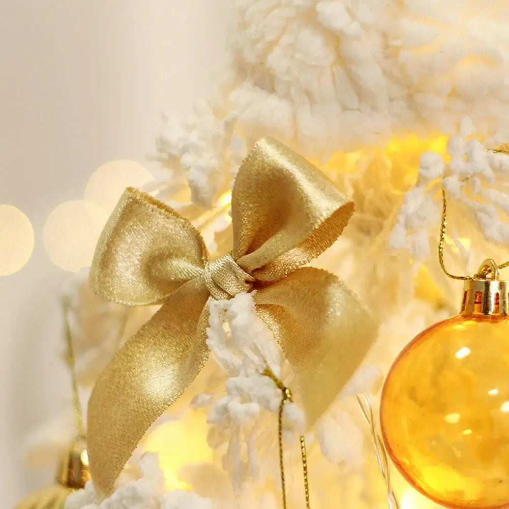 Frosted Noel Tree with Golden Ornaments and Lights